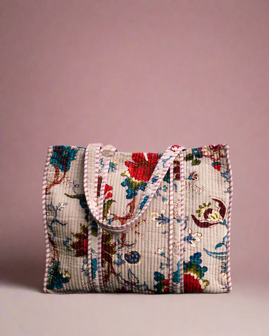 Floral embroidered handbag on a beige background