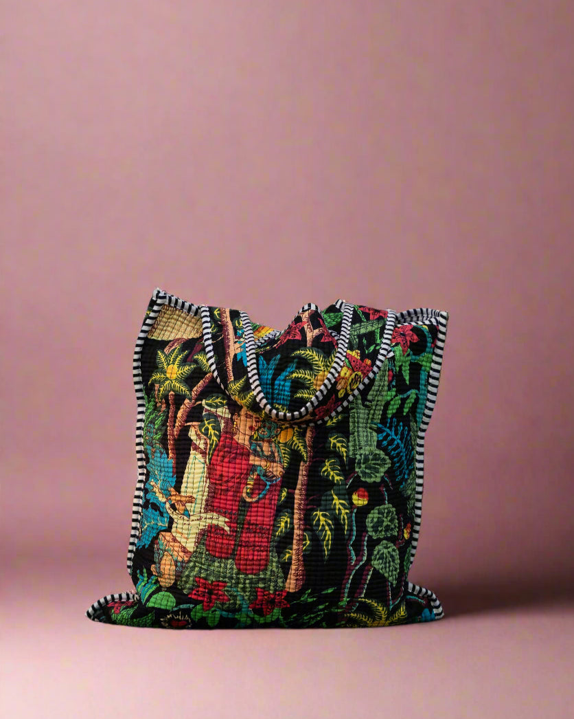 Colorful embroidered bag against a stone wall